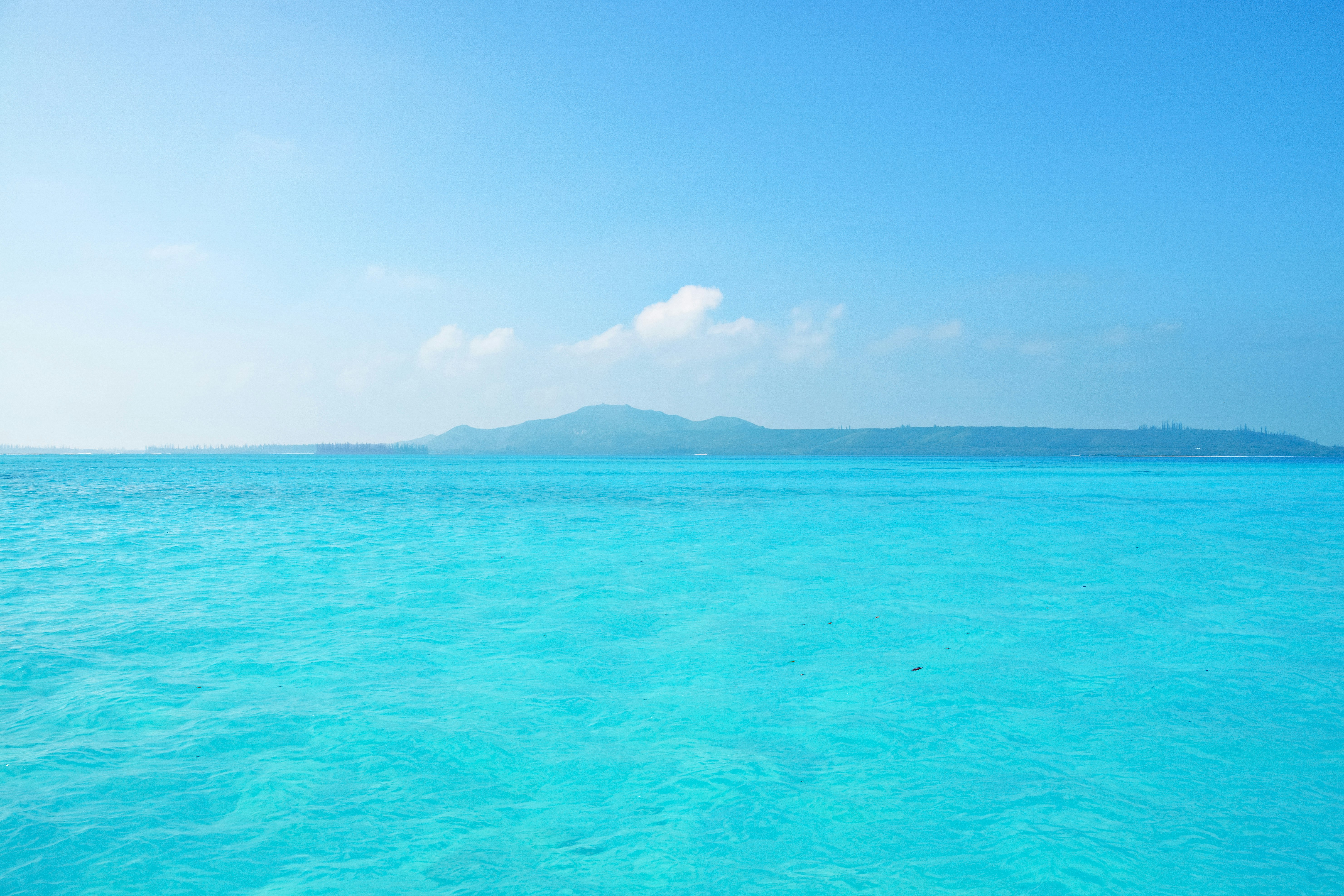 blue sea under blue sky during daytime